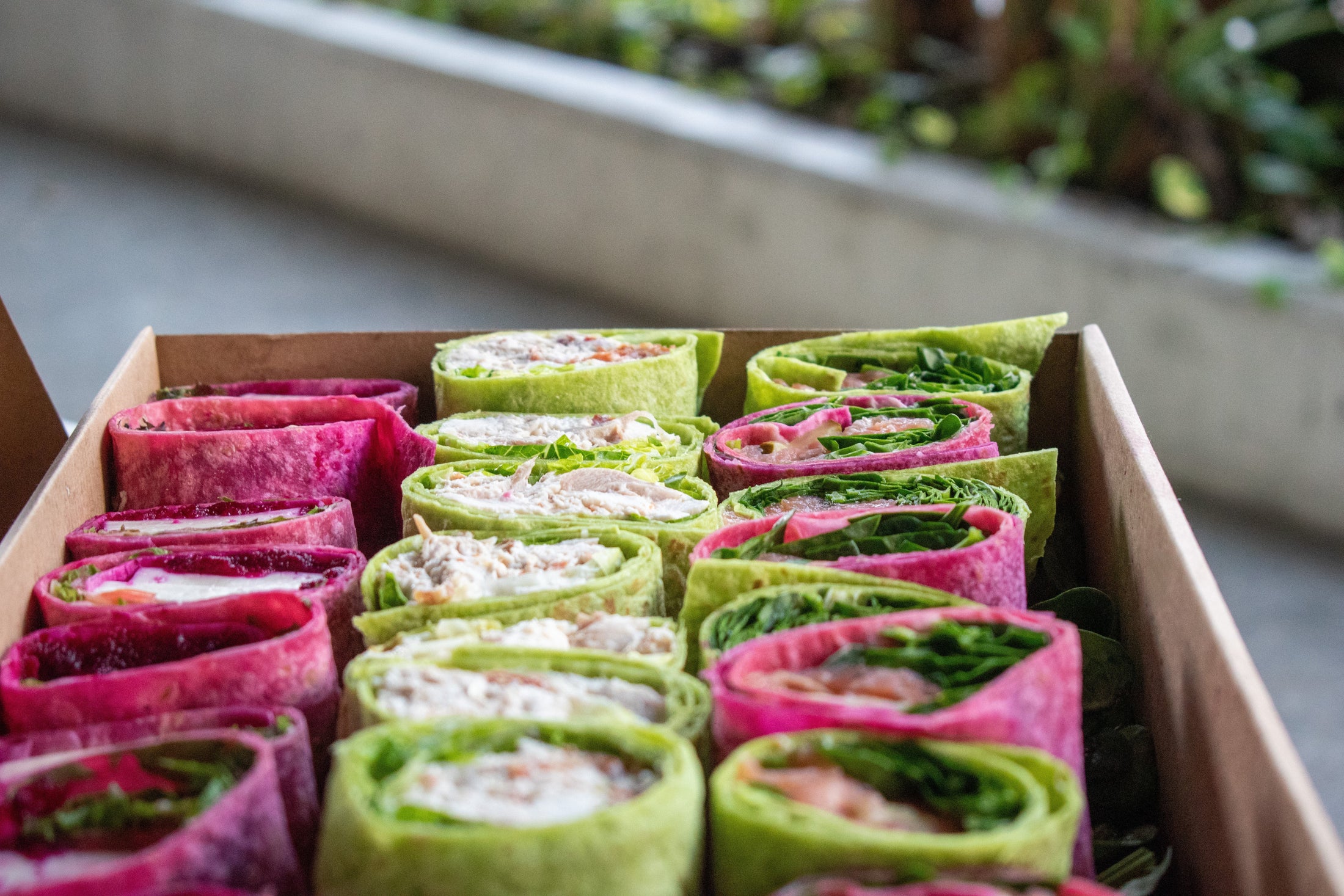 Box of delicious wraps for corporate catering from Belle Epoque ate Emporium Hotel.